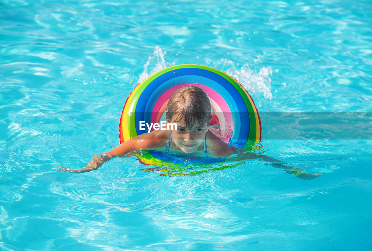 high angle view of boy swimming in undersea