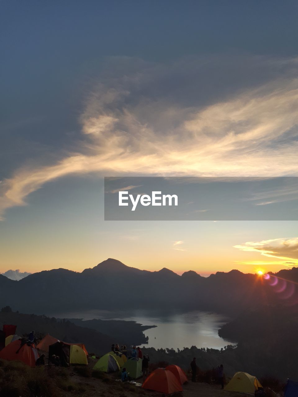 SCENIC VIEW OF MOUNTAINS AGAINST SKY AT SUNSET