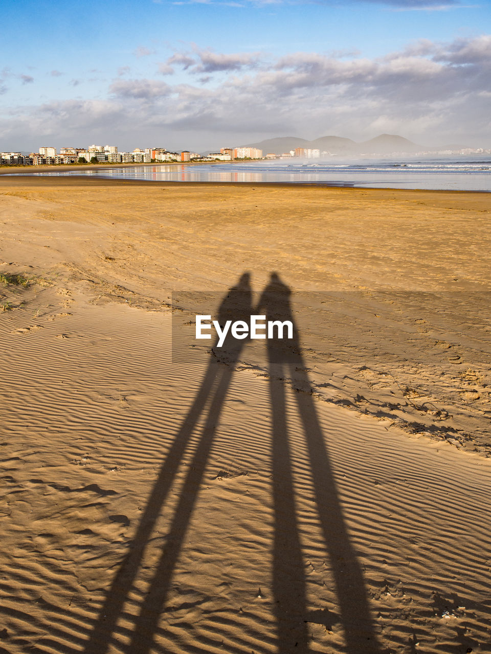 SHADOW OF PEOPLE ON SHORE