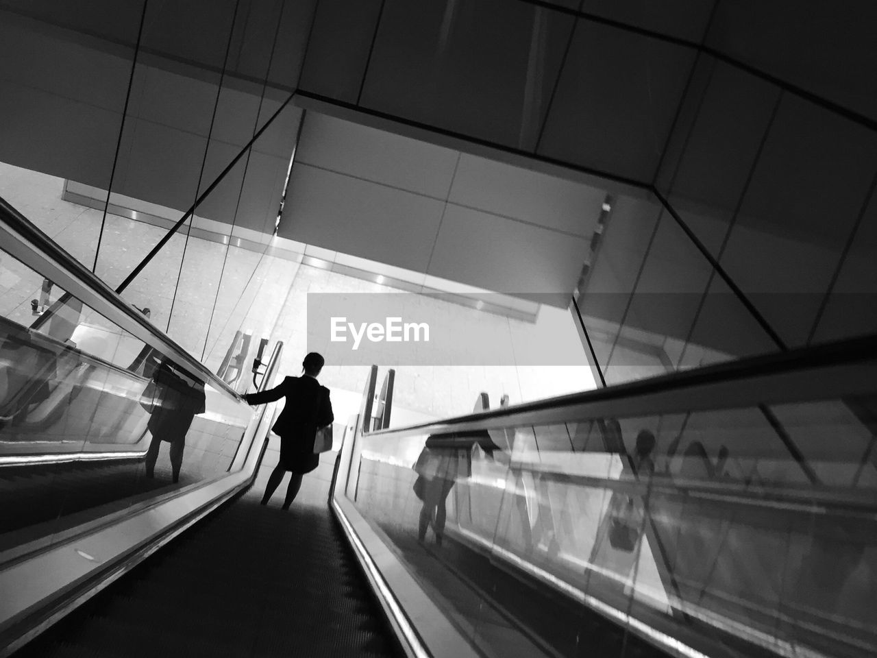 PEOPLE WALKING ON RAILROAD STATION