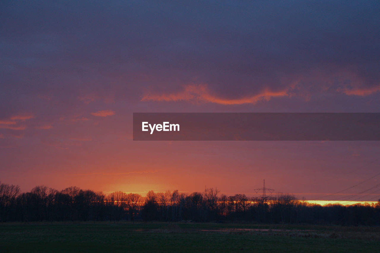 scenic view of landscape against sky during sunset