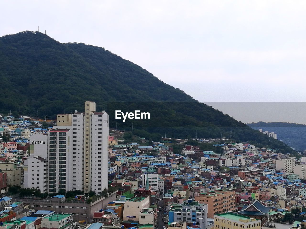 CITYSCAPE AGAINST MOUNTAINS