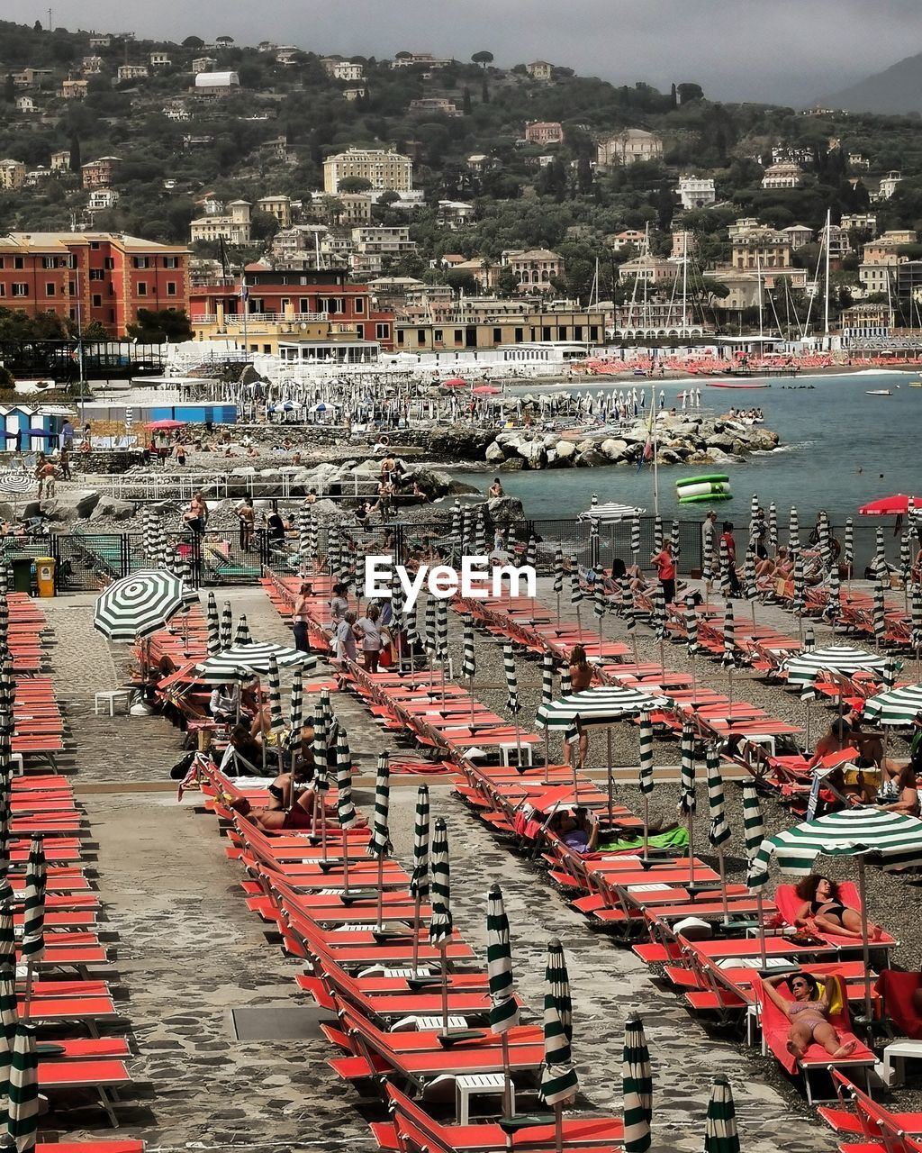 HIGH ANGLE VIEW OF BUILDINGS BY RIVER