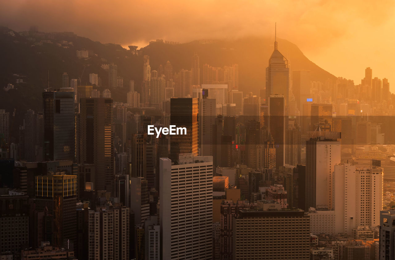 High angle view of city buildings during sunset