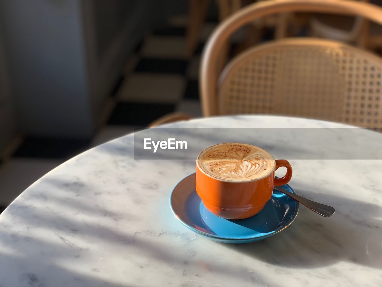 HIGH ANGLE VIEW OF COFFEE ON TABLE IN CAFE