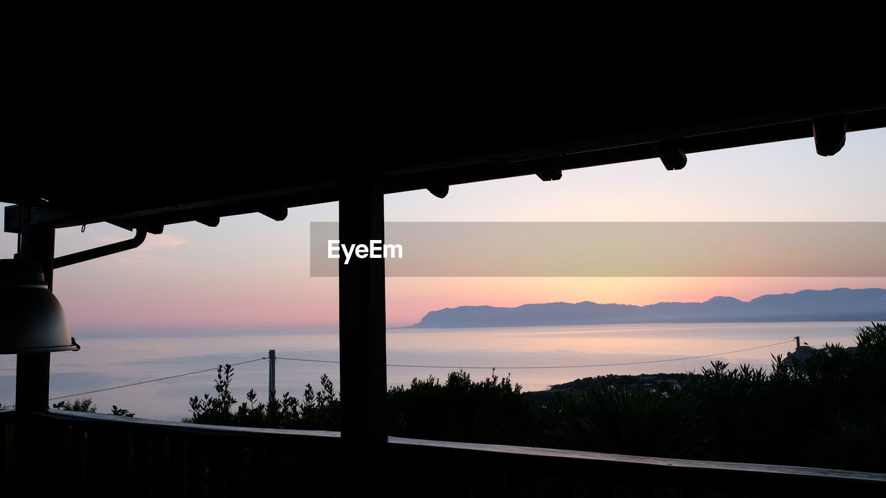 SCENIC VIEW OF LAKE DURING SUNSET