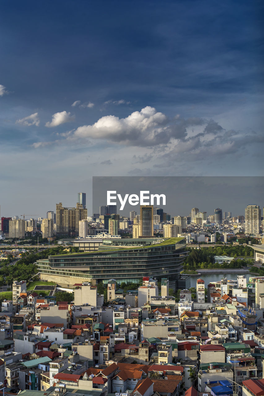 High angle view of buildings in city against sky