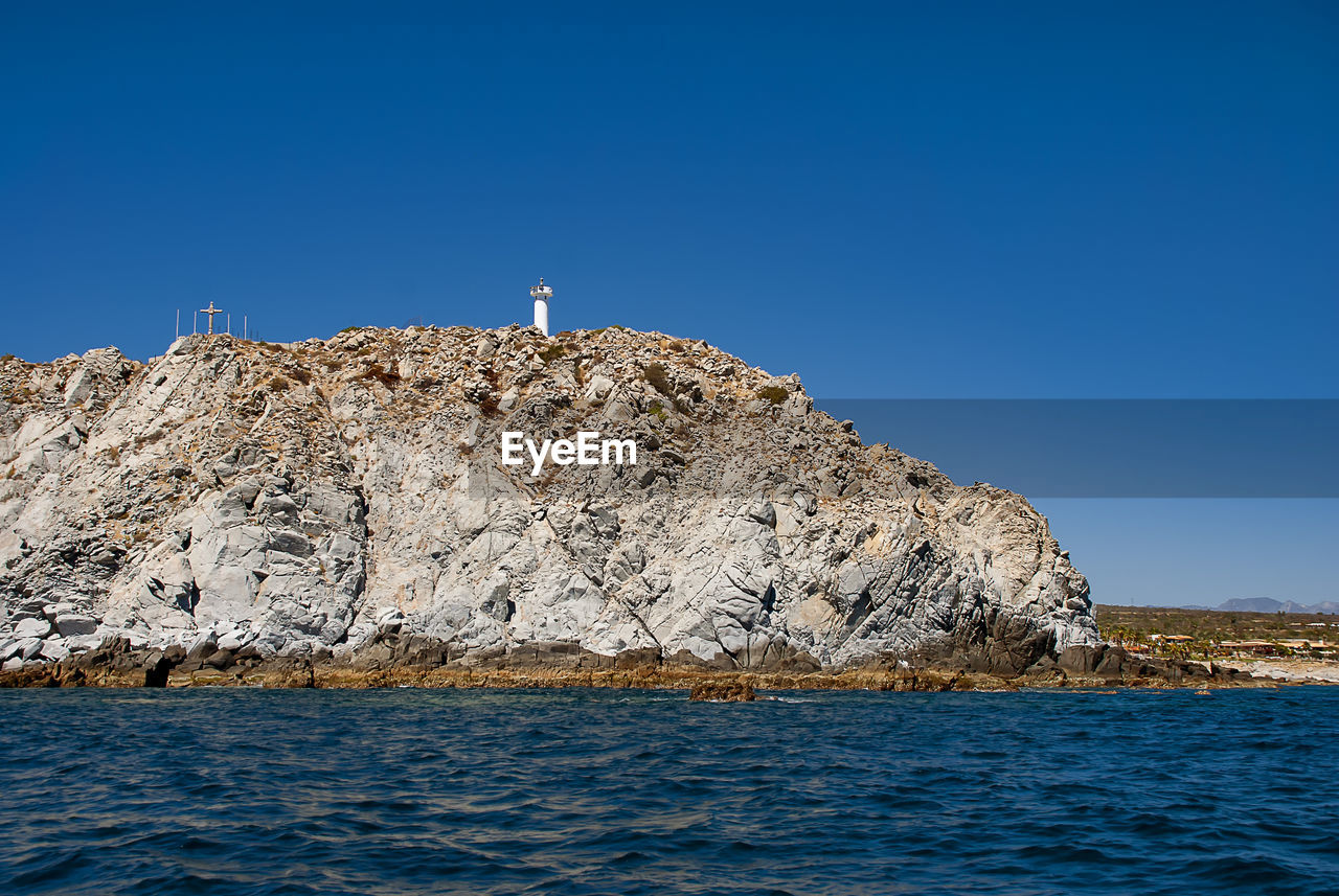 Scenic view of sea against clear blue sky