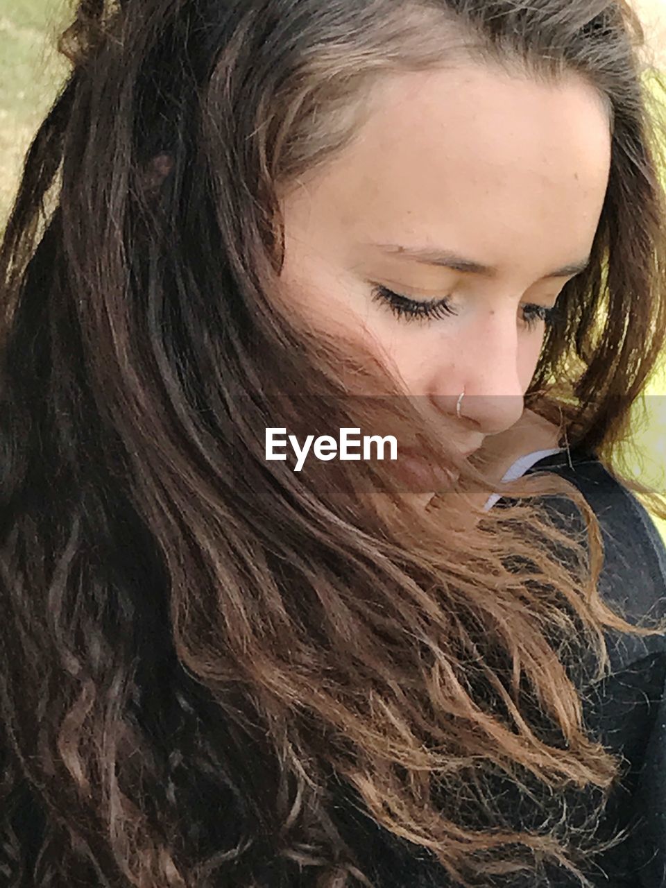 Close-up of young woman with brown hair