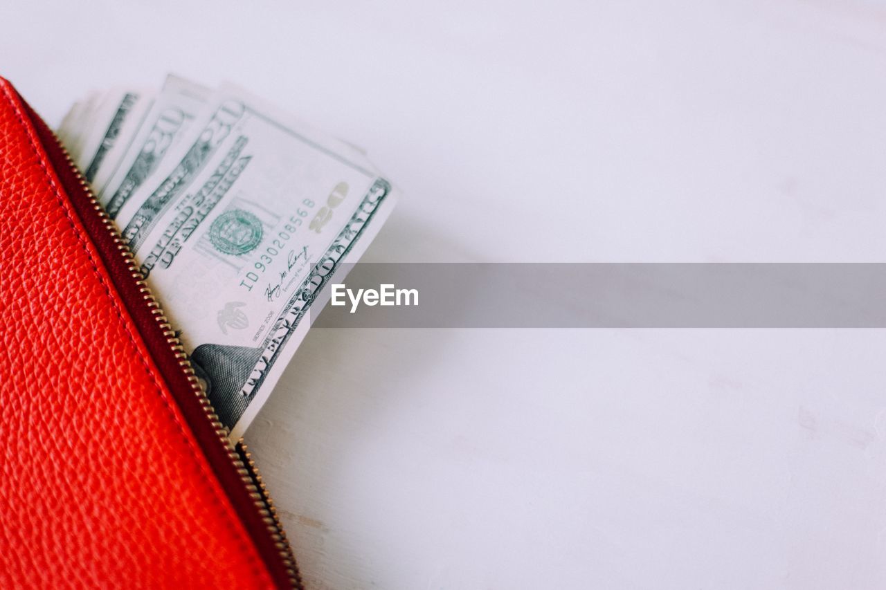 High angle view of money in purse on table