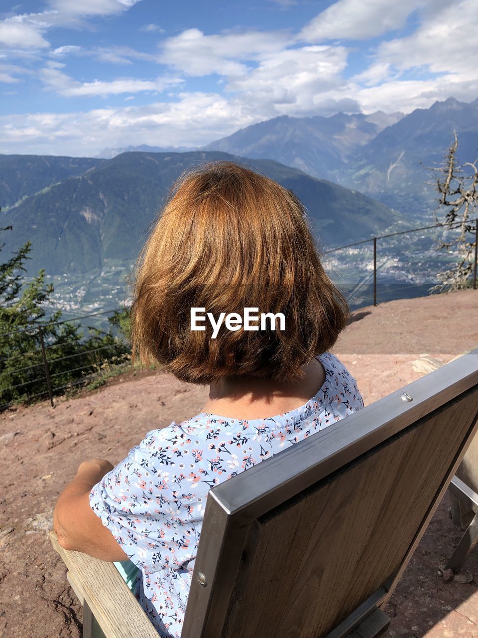 Rear view of woman looking at mountains