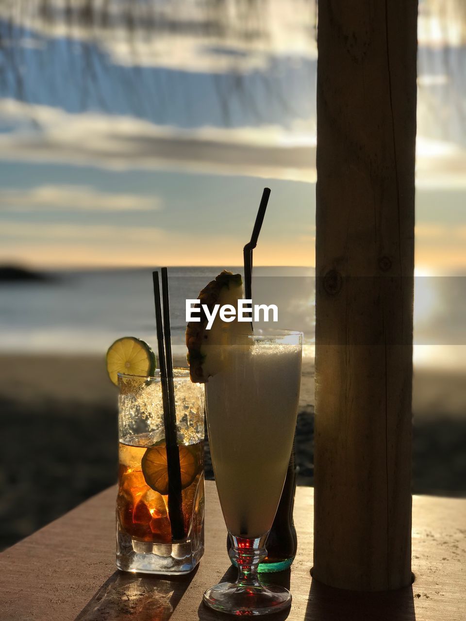 CLOSE-UP OF BEER ON BEACH