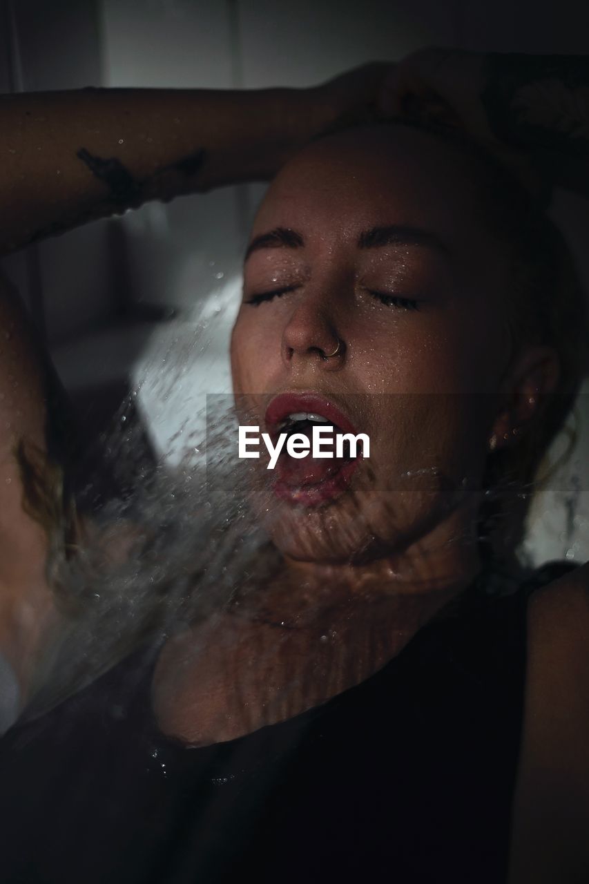 Portrait of young woman in water