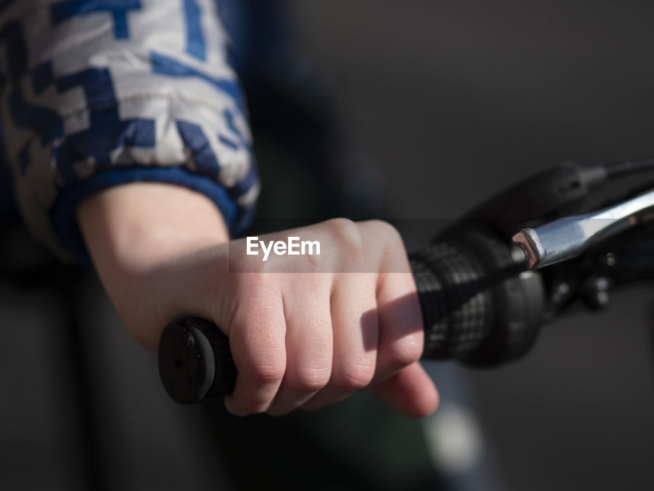 CLOSE-UP OF PERSON HOLDING CAMERA