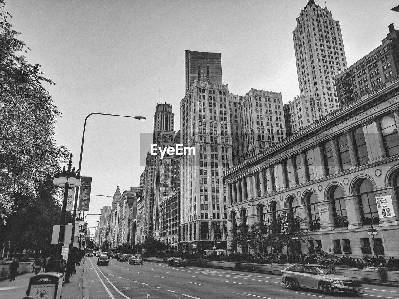 City street and buildings against sky