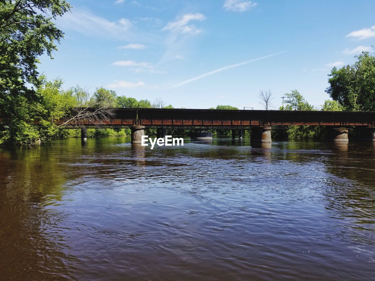 Bridge over river against sky