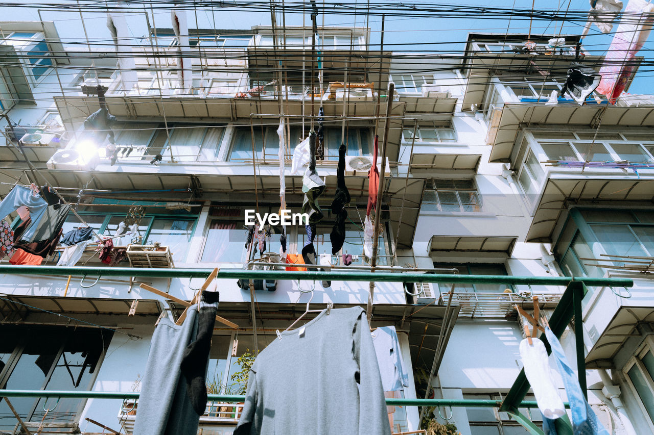 Low angle view of clothes hanging on building