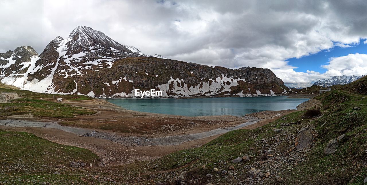 SCENIC VIEW OF SNOWCAPPED MOUNTAIN AGAINST SKY DURING WINTER