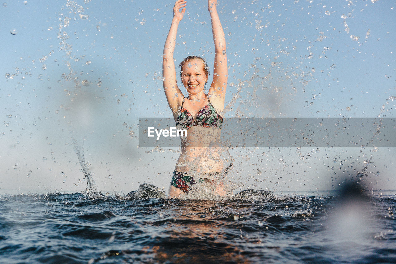 Portrait of girl standing in sea