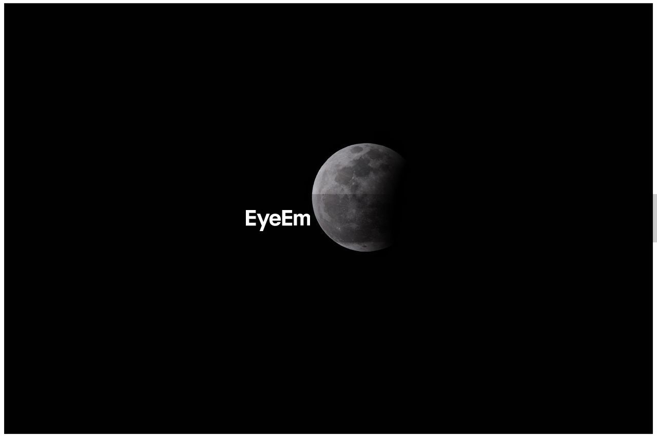 LOW ANGLE VIEW OF MOON AGAINST CLEAR SKY