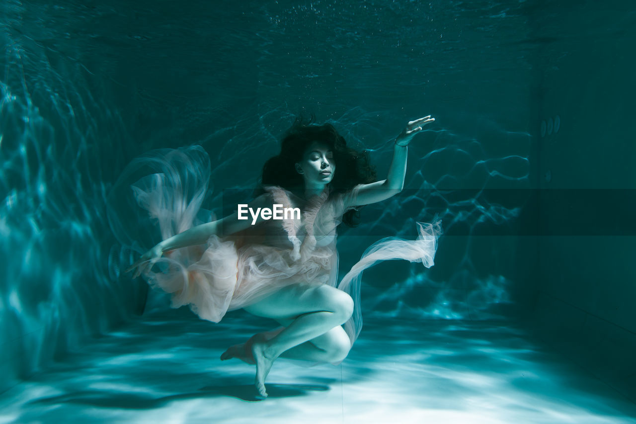 Woman swimming in pool