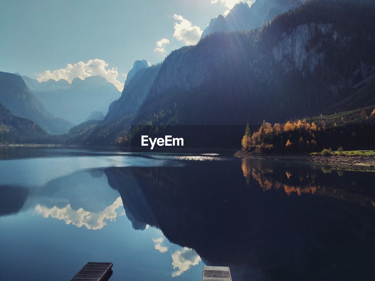 Scenic view of lake and mountains against sky