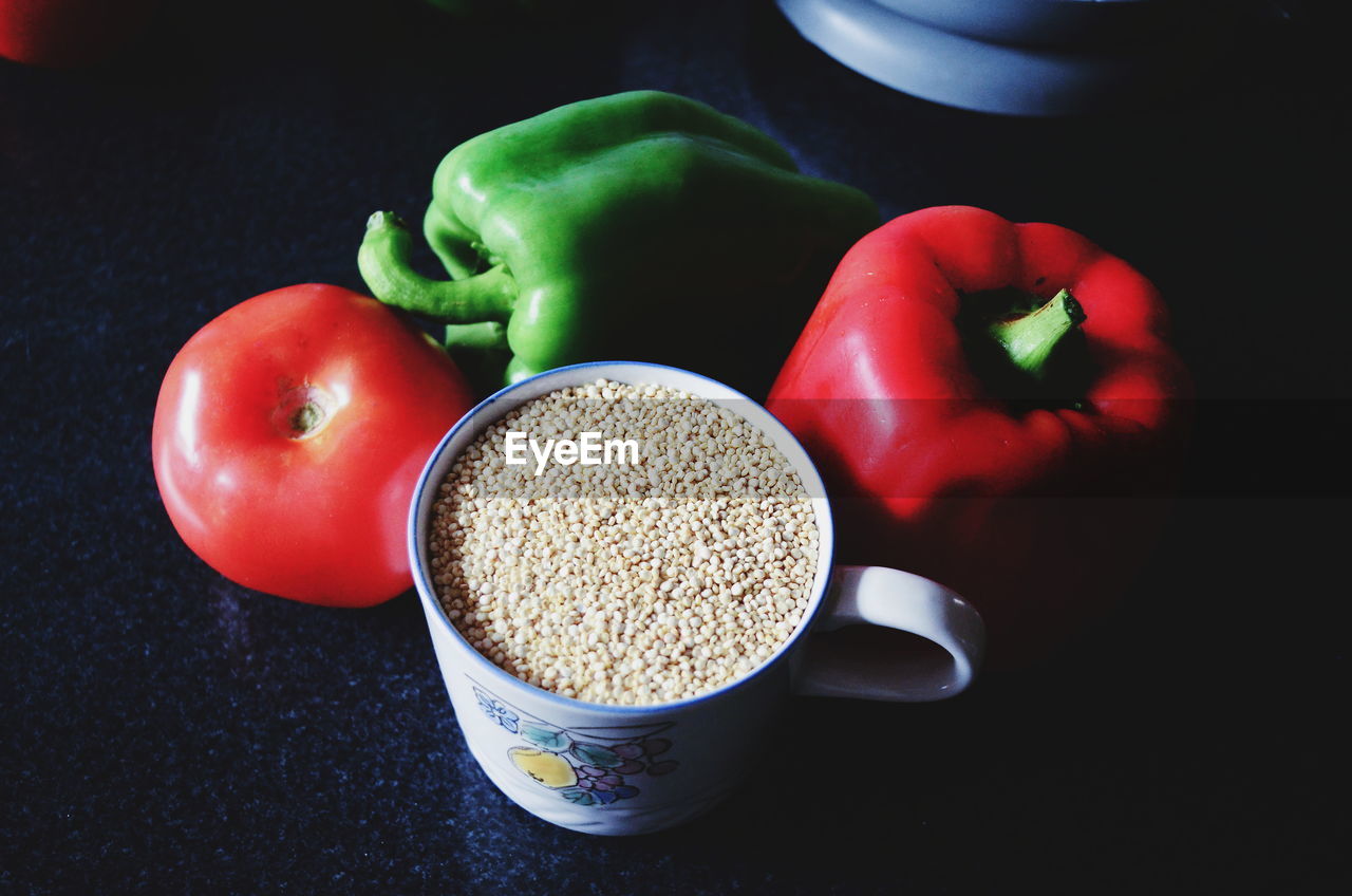 HIGH ANGLE VIEW OF VEGETABLES IN BOWL AGAINST BLACK BACKGROUND