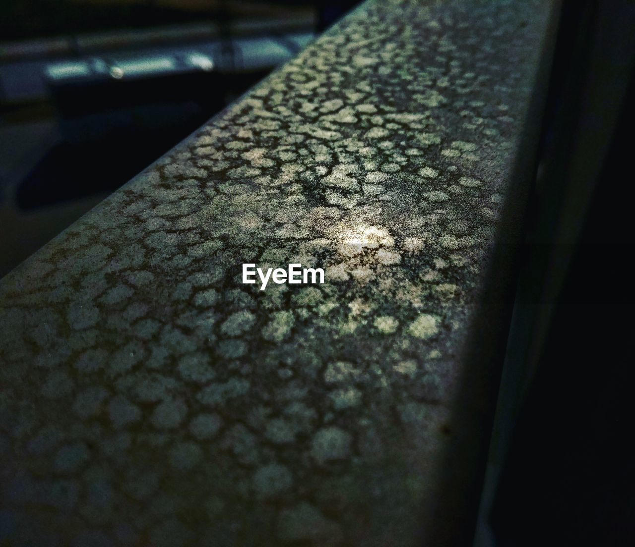 CLOSE-UP OF RUSTY CAR ON WINDSHIELD