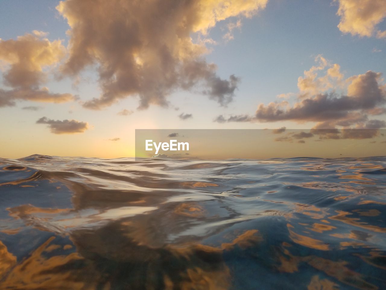 Scenic view of beach against sky during sunset