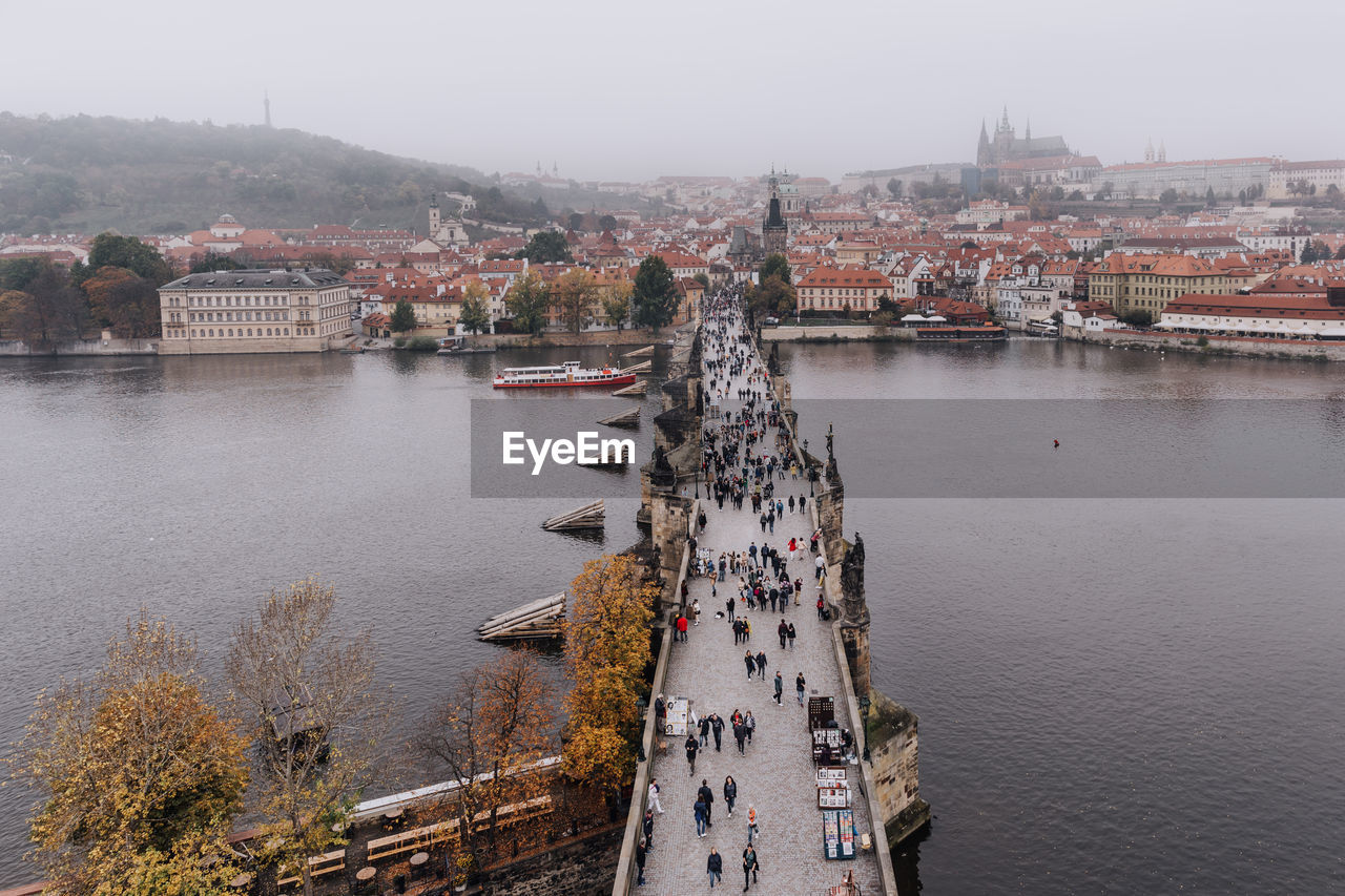 High angle view of river amidst buildings in city