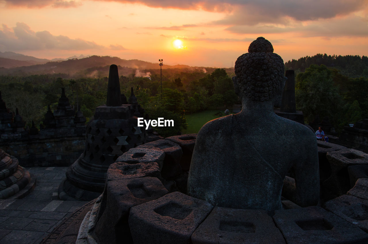 Statue against sky during sunset