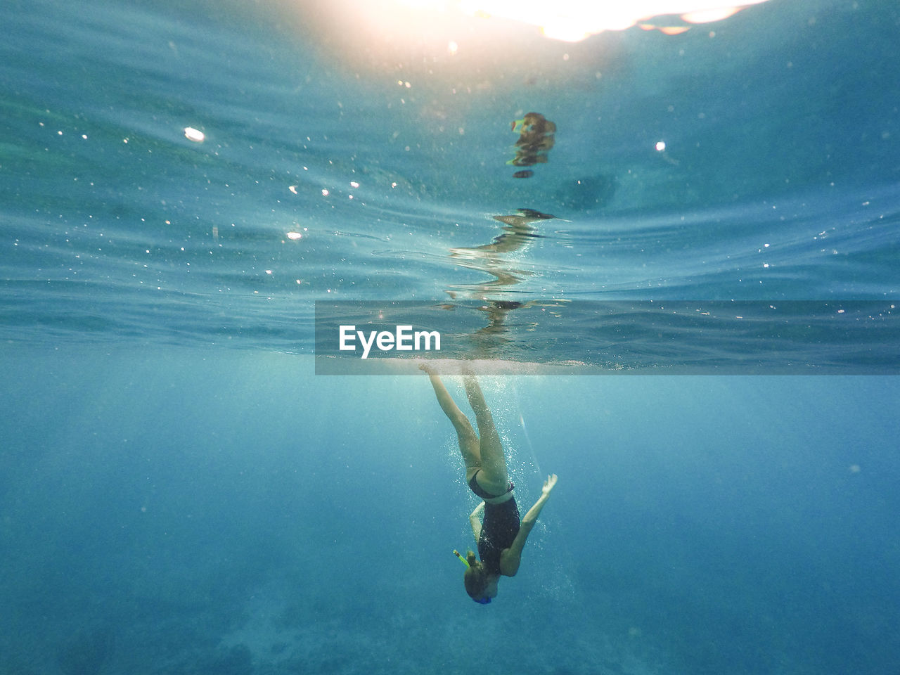 Woman swimming in sea