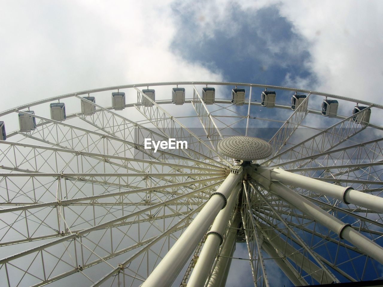 Low angle view of ferris wheel against sky