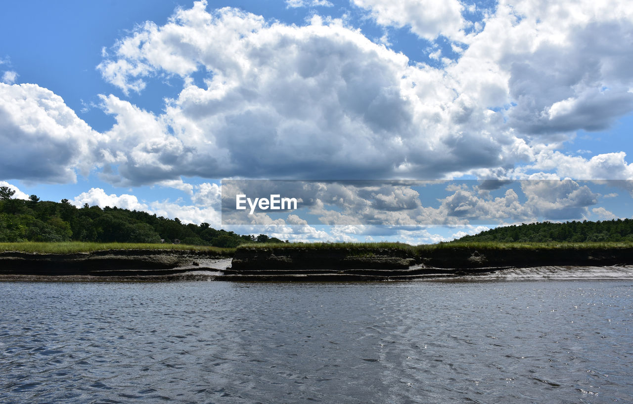 Spring day with lots of clouds over scenic north river.