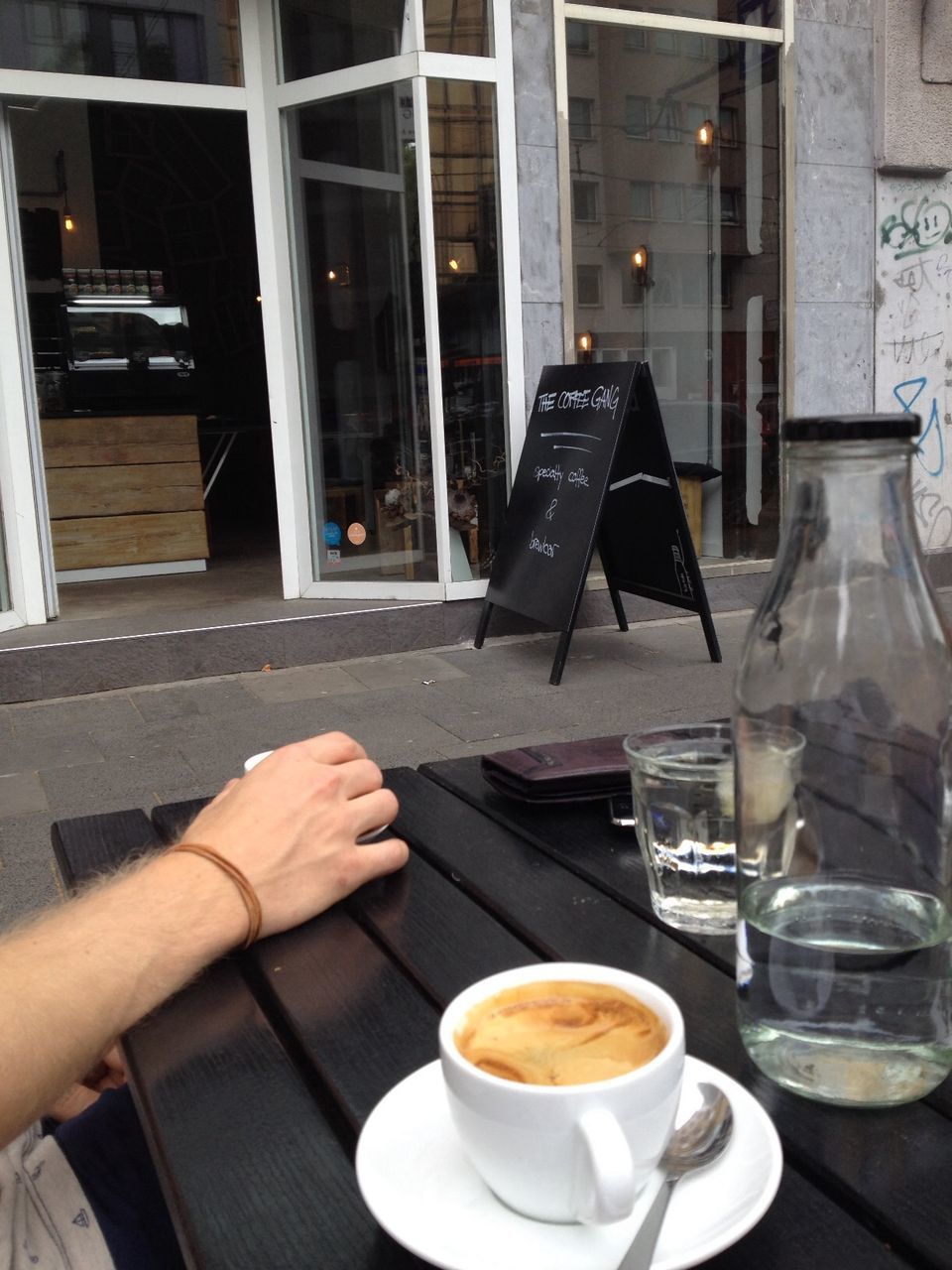 COFFEE CUP WITH COFFEE CUP ON TABLE