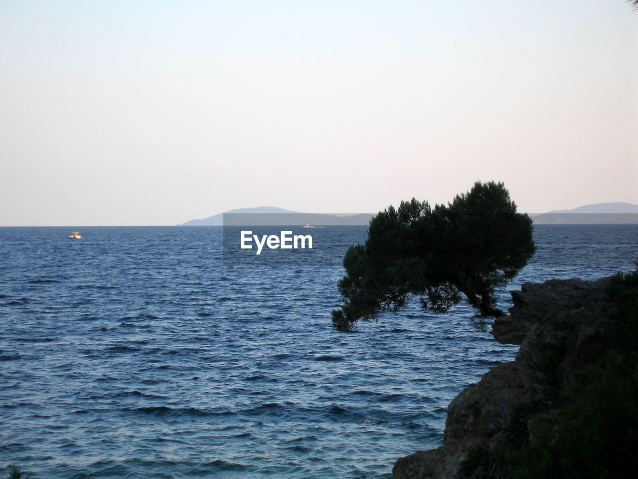 Scenic view of sea against clear sky