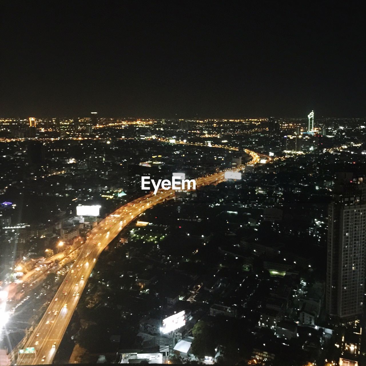 VIEW OF ILLUMINATED CITYSCAPE