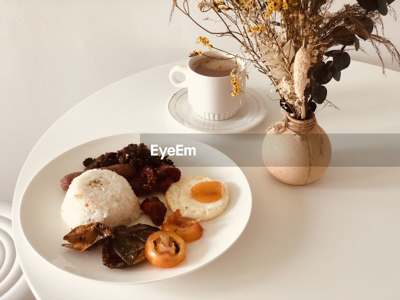 High angle view of breakfast food in plate on table with coffee