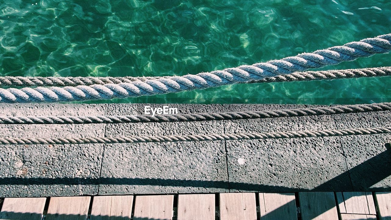 High angle view of ropes over sea