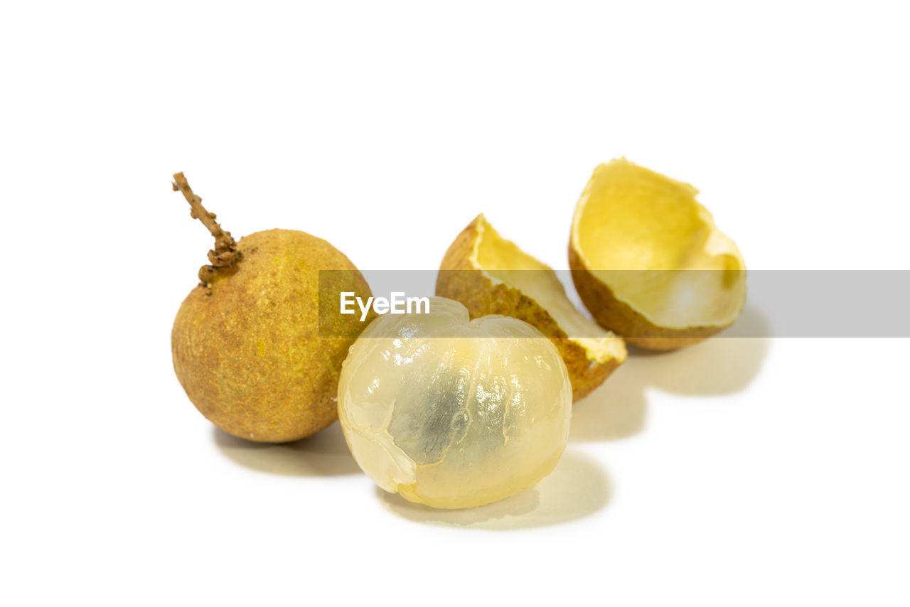 CLOSE-UP OF FRUITS ON WHITE BACKGROUND