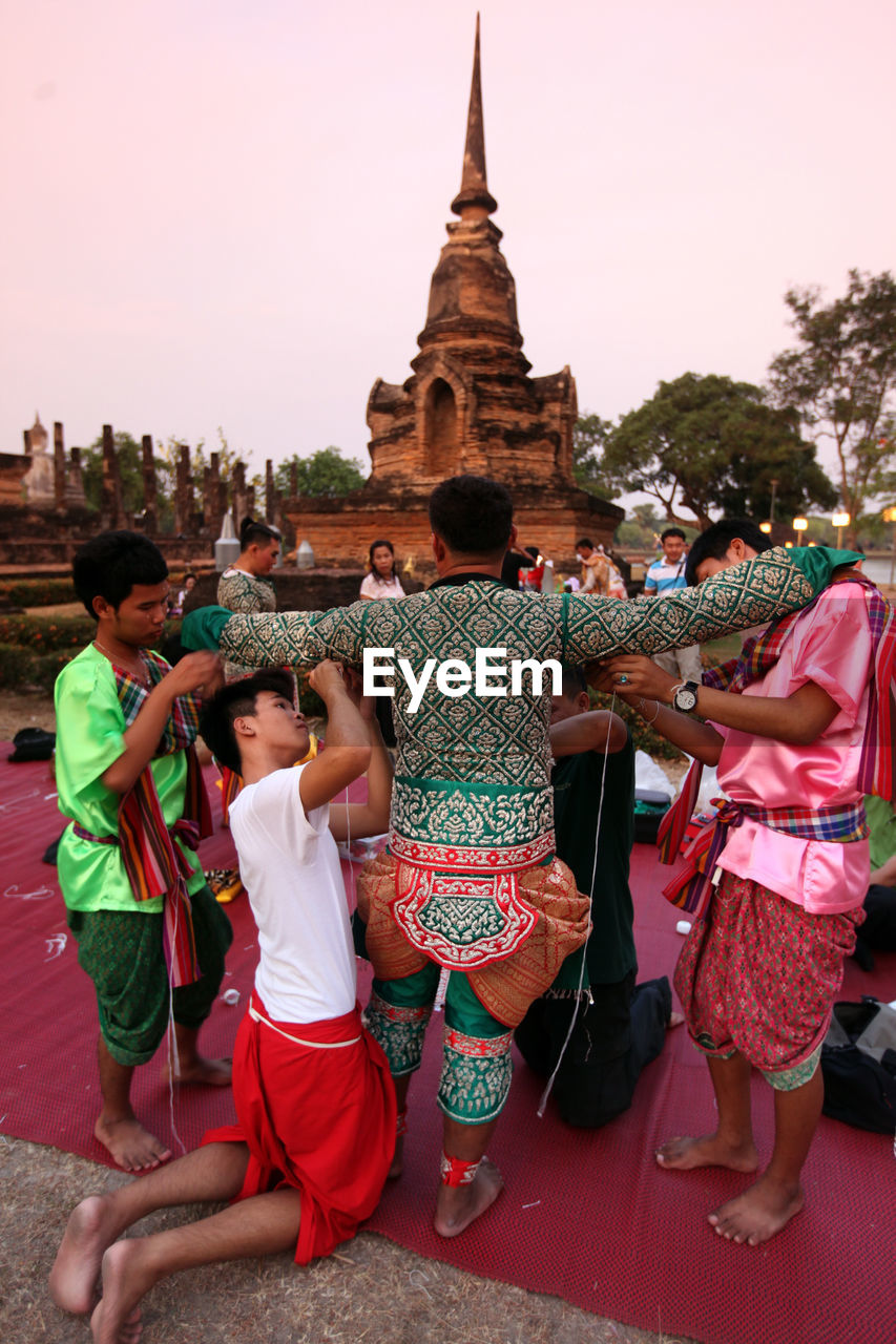 GROUP OF PEOPLE IN TEMPLE BUILDING