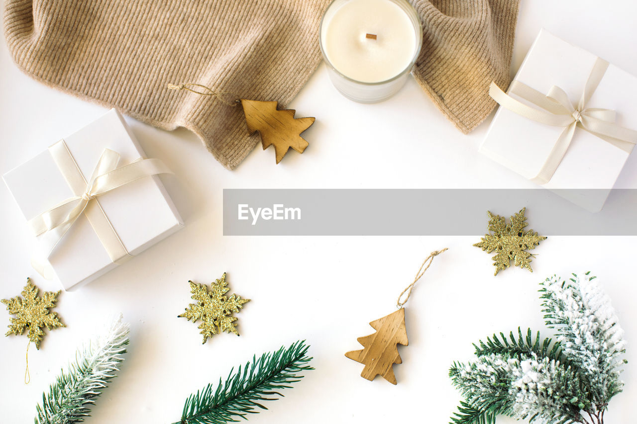 Directly above shot of christmas decorations on white background