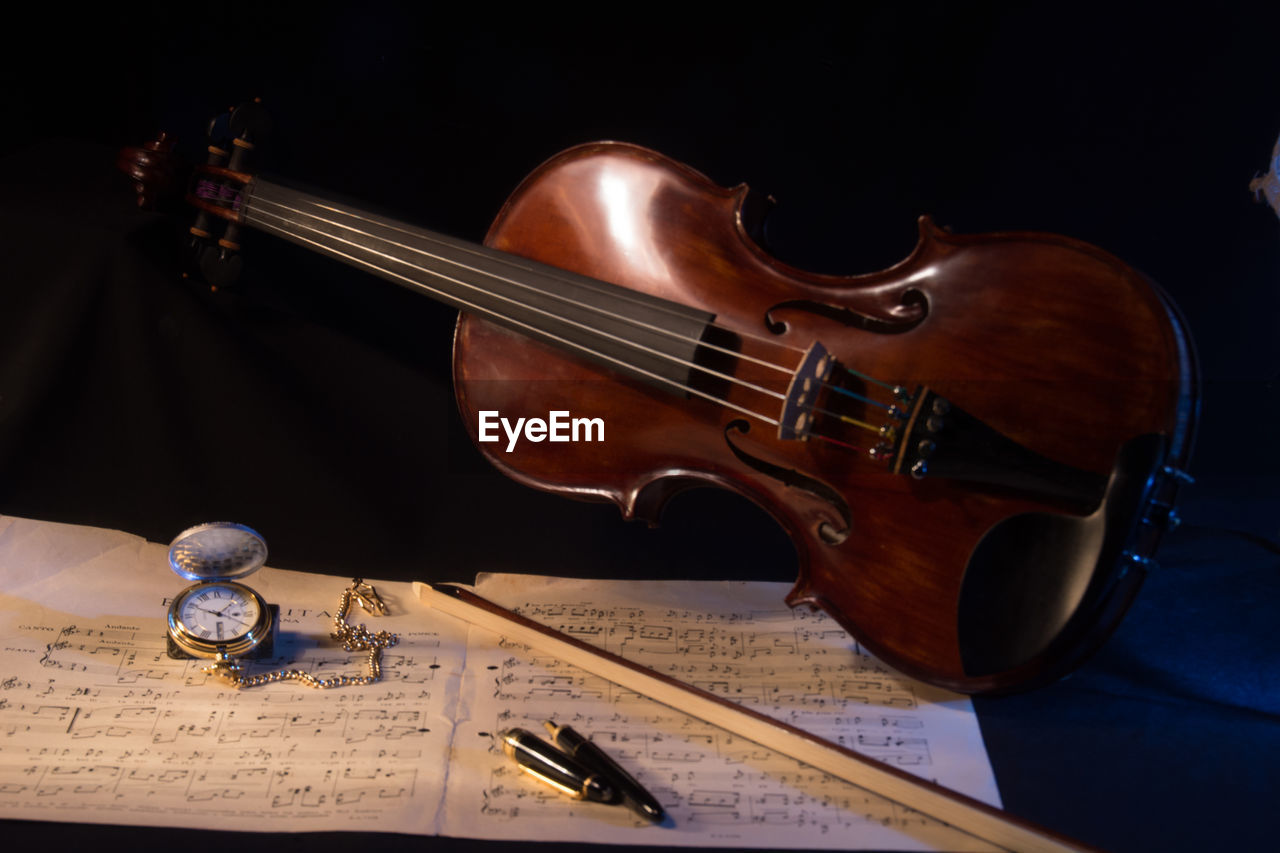 Sheet music and violin on table