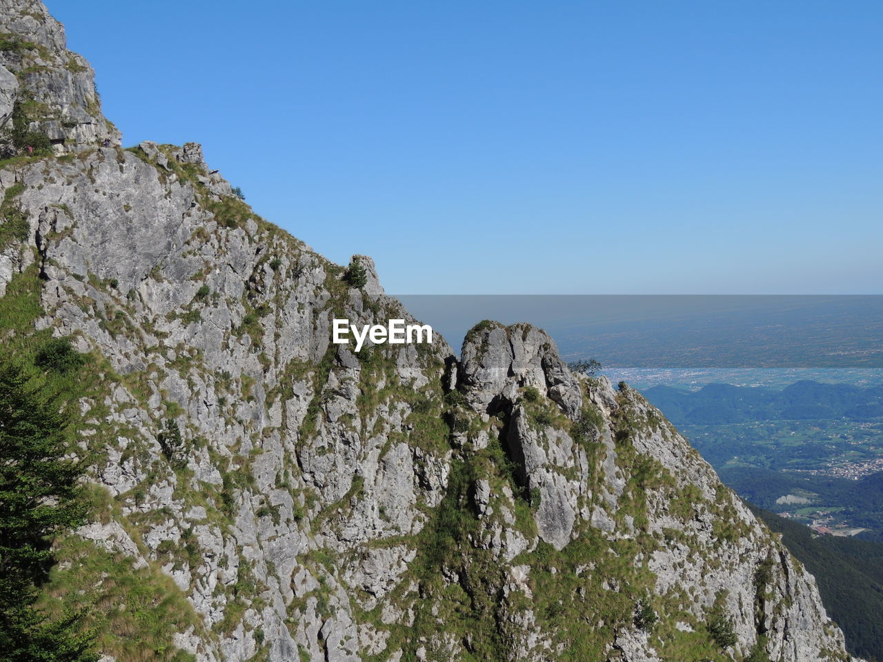 LOW ANGLE VIEW OF ROCK FORMATION AGAINST SKY