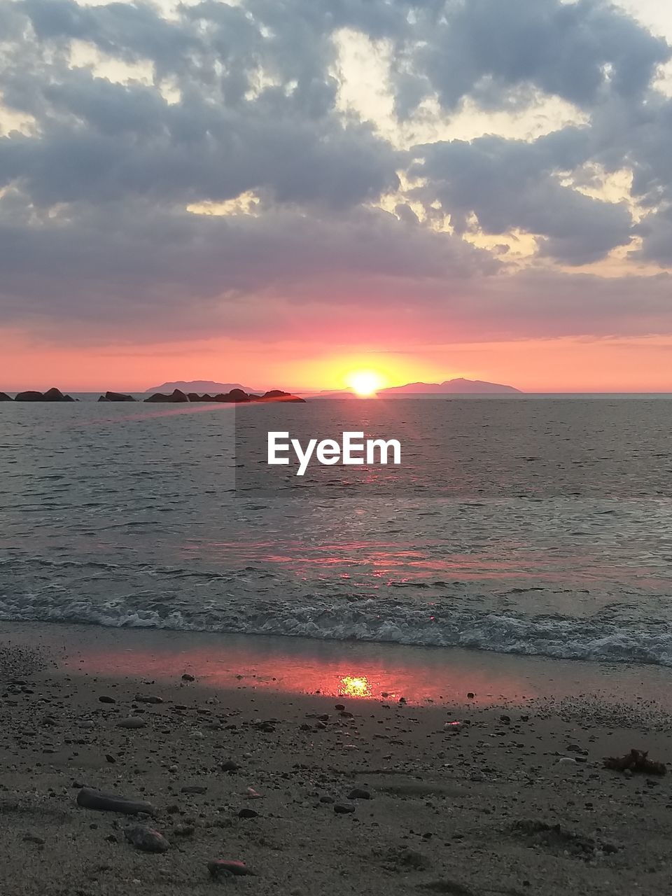 SCENIC VIEW OF SEA AGAINST ORANGE SKY