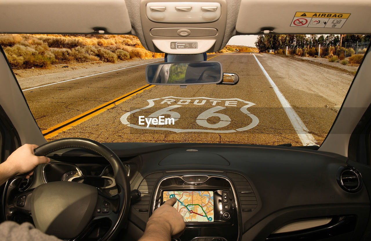 Man using global positioning system in car 