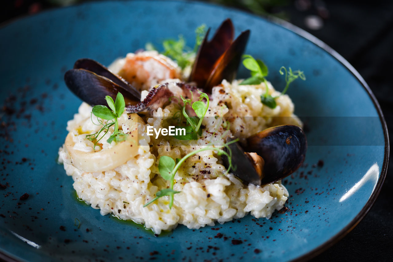 Tasty italian risotto with seafood and spices