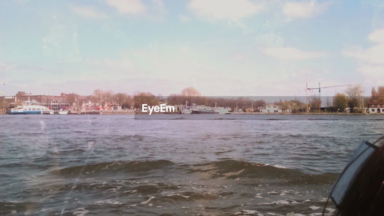 VIEW OF BUILDINGS AT WATERFRONT