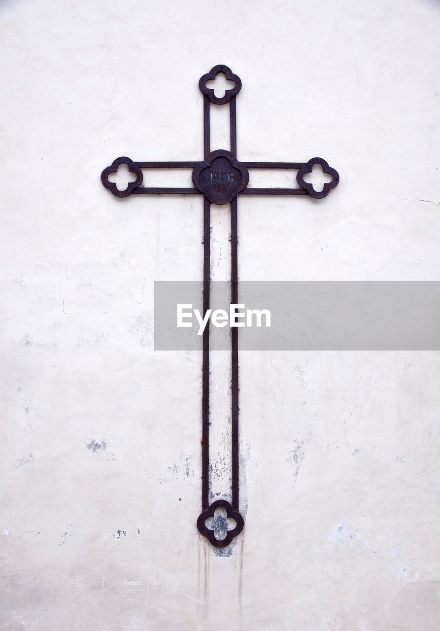 Close-up of cross on wall