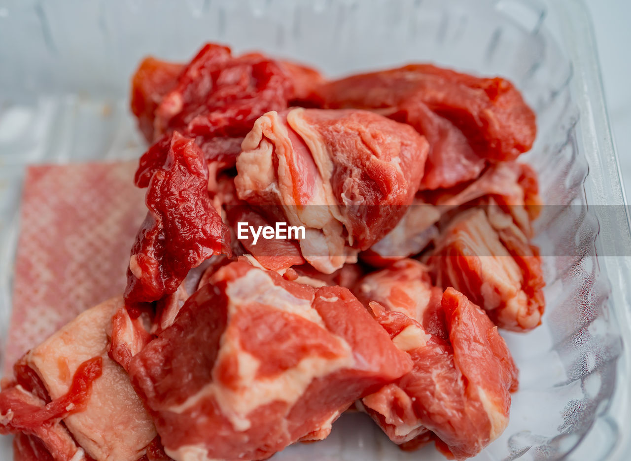 High angle view of chopped meat in plate on table